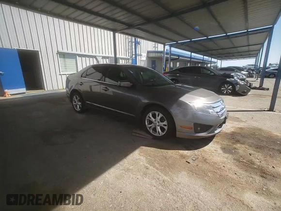 2012 Ford Fusion SE z VIN 3FAHP0HAXCR231865, wystawiony jako Copart lot #52644815 z przebiegiem 153 058 mil mil oraz Szkoda całkowita • Salvage title. Historia ofert i sprzedaży dostępna na DreamBid. Obrazek 10.