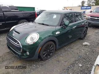 2016 MINI Cooper Hardtop 4 Door S with VIN WMWXU3C58G2D31595, listed as a IAAI auction lot 41267547 with 145,191 mi miles. Bid and sale history available at carsss.com. Image 2.