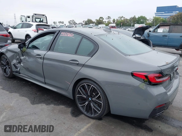 2022 BMW 5 Series M550i xDrive with VIN WBA13BK07NCL07995, listed as a IAAI auction lot 42454963 with 12,721 mi miles and . Bid and sale history available at DreamBid. Image 3.