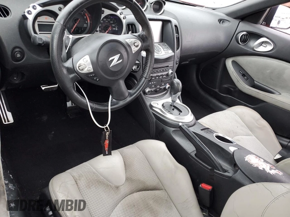 2009 Nissan 370Z z VIN JN1AZ44E19M400603, wystawiony jako Copart lot #79878474 z przebiegiem 129 976 mil mil oraz Szkoda całkowita • Salvage title. Historia ofert i sprzedaży dostępna na DreamBid. Obrazek 8.