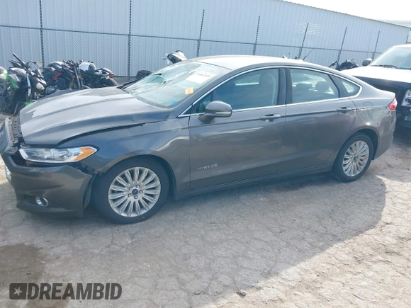 2015 Ford Fusion SE Hybrid with VIN 3FA6P0LUXFR266743, listed as a IAAI auction lot 40862039 with 116,610 mi miles. Bid and sale history available at carsss.com. Image 2.