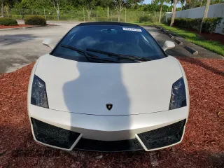 2012 Lamborghini Gallardo z VIN ZHWGU6BZ7CLA11933, wystawiony jako Copart lot #74679154 z przebiegiem Nie podano mil oraz Szkody całkowita. Historia ofert i sprzedaży dostępna na DreamBid. Obrazek 5.
