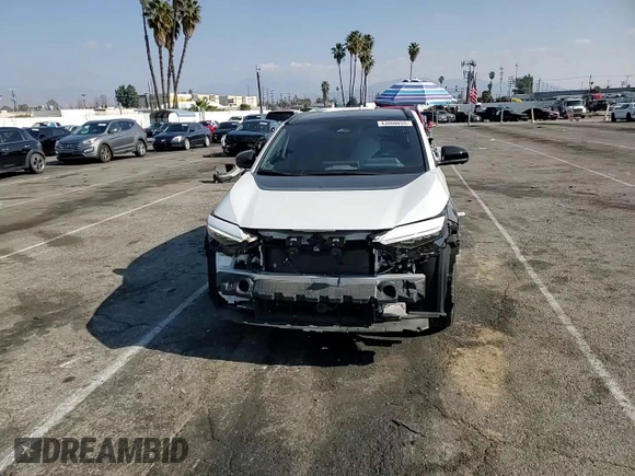 2024 Toyota bZ4X XLE with VIN JTMABACA6RA065029, listed as a Copart auction lot 43008655 with 15,489 mi miles and Salvage Title. Bid and sale history available at DreamBid. Image 12.