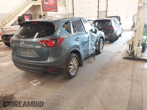 2016 Mazda CX-5 Touring z VIN JM3KE4CY2G0839202, wystawiony jako IAAI lot #41901207 z przebiegiem 65 449 mil mil oraz . Historia ofert i sprzedaży dostępna na DreamBid. Obrazek 4.