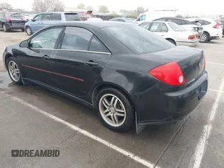 2009 Pontiac G6 1SB with VIN 1G2ZJ57B594263412, listed as a IAAI auction lot 41844953 with 234,057 mi miles and . Bid and sale history available at DreamBid. Image 3.
