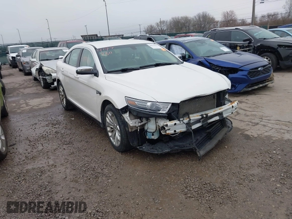 2015 Ford Taurus Limited with VIN 1FAHP2F85FG117635, listed as a IAAI auction lot 41979311 with 104,314 mi miles. Bid and sale history available at carsss.com. Image 1.
