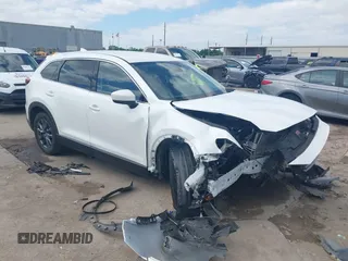 2022 Mazda CX-9 Touring with VIN JM3TCBCY0N0608052, listed as a IAAI auction lot 42027465 with 65,313 mi miles and . Bid and sale history available at DreamBid. Image 1.