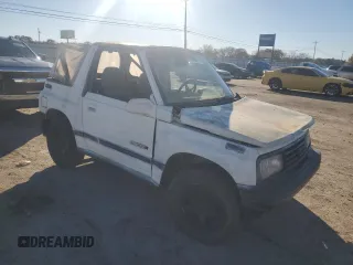 1990 Geo Tracker z VIN 2CNBJ18UXL6217744, wystawiony jako Copart lot #84203244 z przebiegiem 23 221 mil mil oraz Szkody całkowita. Historia ofert i sprzedaży dostępna na DreamBid. Obrazek 4.