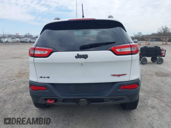 2015 Jeep Cherokee Trailhawk with VIN 1C4PJMBB7FW741365, listed as a IAAI auction lot 41879685 with 94,135 mi miles and . Bid and sale history available at carsss.com. Image 17.