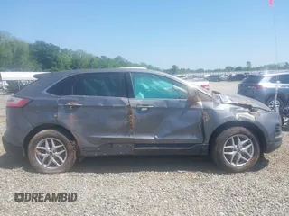 2023 Ford Edge SEL z VIN 2FMPK4J97PBA31506, wystawiony jako IAAI lot #42071208 z przebiegiem 50 458 mil mil oraz . Historia ofert i sprzedaży dostępna na DreamBid. Obrazek 13.