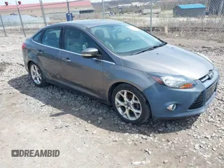 2014 Ford Focus Titanium with VIN 1FADP3J2XEL339925, listed as a IAAI auction lot 41935292 with 120,659 mi miles. Bid and sale history available at carsss.com. Image 1.