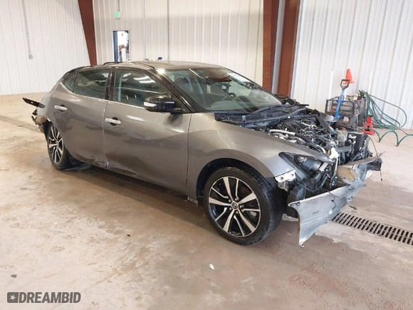2021 Nissan Maxima SV with VIN 1N4AA6CV9MC513527, listed as a IAAI auction lot 40056232 with 54,583 mi miles. Bid and sale history available at carsss.com. Image 1.