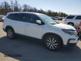 2021 Honda Pilot EX-L with VIN 5FNYF6H59MB051833, listed as a Copart auction lot 50360485 with 153,971 mi miles and Salvage Title. Bid and sale history available at DreamBid. Image 4.