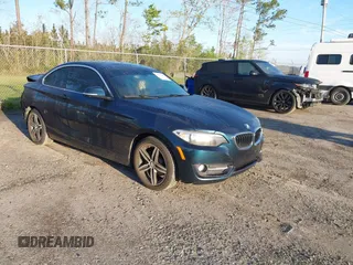 2017 BMW 2 Series 230i with VIN WBA2F9C3XHV983993, listed as a IAAI auction lot 41790242 with 76,620 mi miles. Bid and sale history available at carsss.com. Image 1.