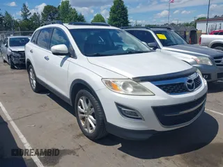 2012 Mazda CX-9 Grand Touring z VIN JM3TB2DA0C0360225, wystawiony jako IAAI lot #42181667 z przebiegiem 195 306 mil mil oraz . Historia ofert i sprzedaży dostępna na DreamBid. Obrazek 1.
