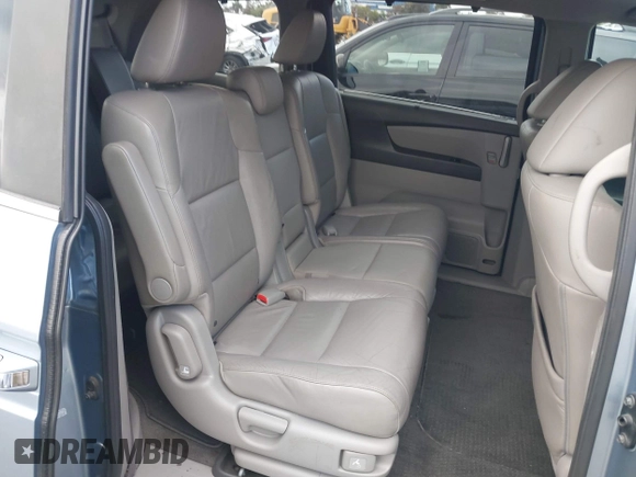 2012 Honda Odyssey EX-L with VIN 5FNRL5H60CB095086, listed as a IAAI auction lot 42251330 with 144,232 mi miles and . Bid and sale history available at DreamBid. Image 8.