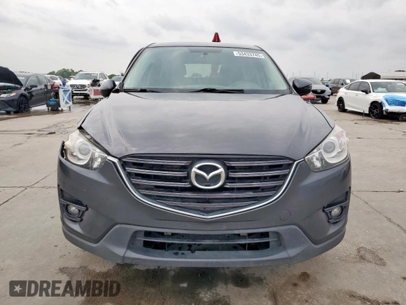 2016 Mazda CX-5 Touring z VIN JM3KE2CY7G0654292, wystawiony jako Copart lot #53433745 z przebiegiem 168 273 mil mil oraz Szkoda całkowita • Salvage title. Historia ofert i sprzedaży dostępna na DreamBid. Obrazek 5.