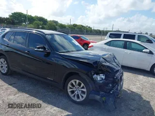 2014 BMW X1 xDrive28i with VIN WBAVL1C58EVY24362, listed as a IAAI auction lot 41938457 with 146,252 mi miles. Bid and sale history available at carsss.com. Image 1.