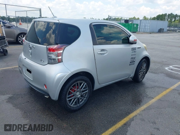 2013 Scion iQ with VIN JTNJJXB00DJ023345, listed as a IAAI auction lot 42631440 with 73,105 mi miles and . Bid and sale history available at DreamBid. Image 4.