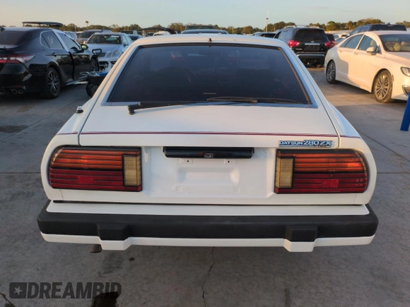 1983 Datsun 280ZX z VIN JN1HZ04S2DX564639, wystawiony jako Copart lot #75222314 z przebiegiem 75 925 mil mil oraz Szkody całkowita. Historia ofert i sprzedaży dostępna na DreamBid. Obrazek 6.
