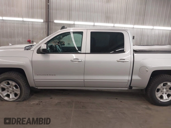 2017 Chevrolet Silverado 1500 LT with VIN 3GCUKREC5HG318772, listed as a IAAI auction lot 42056116 with 82,987 mi miles and . Bid and sale history available at DreamBid. Image 15.