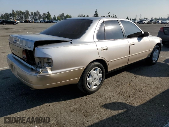 1995 Toyota Camry LE with VIN JT2GK12E7S0107467, listed as a Copart auction lot 83491534 with 112,971 mi miles and Salvage Title. Bid and sale history available at carsss.com. Image 3.