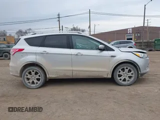 2015 Ford Escape Titanium with VIN 1FMCU9J92FUA60166, listed as a IAAI auction lot 41914080 with 103,122 mi miles and . Bid and sale history available at DreamBid. Image 13.