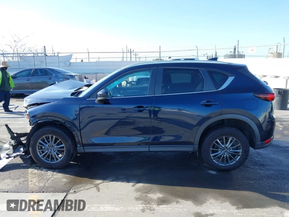 2019 Mazda CX-5 Touring with VIN JM3KFACM7K1534905, listed as a IAAI auction lot 41945607 with 56,014 mi miles. Bid and sale history available at carsss.com. Image 15.