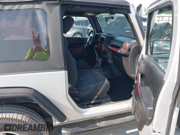 2012 Jeep Wrangler Sport z VIN 1C4AJWAG9CL255278, wystawiony jako IAAI lot #42469091 z przebiegiem 140 480 mil mil oraz . Historia ofert i sprzedaży dostępna na DreamBid. Obrazek 5.