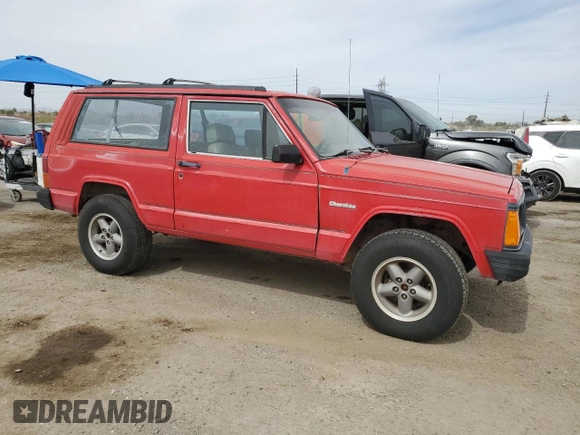 1993 Jeep Cherokee SE with VIN 1J4FT27P2PL619945, listed as a Copart auction lot 59053465 with 222,336 mi miles and Clean title. Bid and sale history available at DreamBid. Image 4.