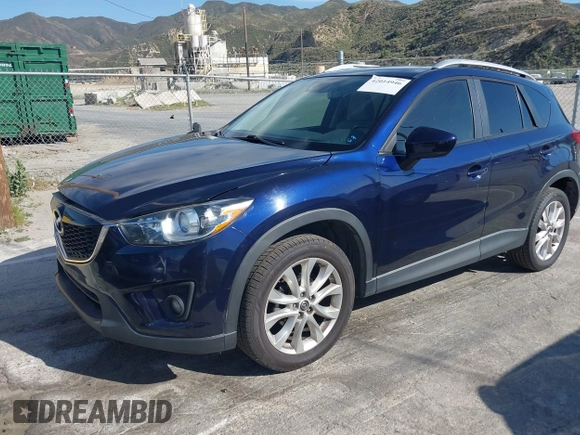 2014 Mazda CX-5 Grand Touring with VIN JM3KE2DY7E0376389, listed as a IAAI auction lot 42014946 with 126,081 mi miles. Bid and sale history available at carsss.com. Image 2.
