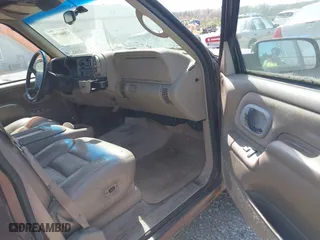 1997 Chevrolet Tahoe with VIN 1GNEK13R5VJ386701, listed as a IAAI auction lot 42046195 with 241,735 mi miles. Bid and sale history available at carsss.com. Image 5.