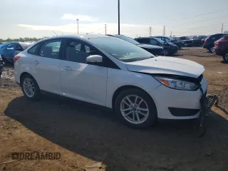 2017 Ford Focus SE with VIN 1FADP3F26HL313478, listed as a Copart auction lot 57078015 with 56,807 mi miles and Salvage title. Bid and sale history available at DreamBid. Image 4.