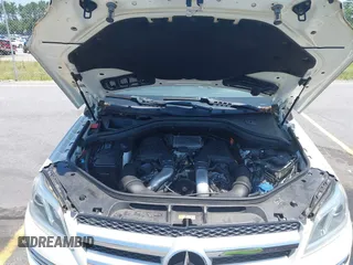2014 Mercedes-Benz GL 450 with VIN 4JGDF7CE4EA348588, listed as a IAAI auction lot 42601136 with 129,166 mi miles and . Bid and sale history available at DreamBid. Image 10.