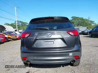 2014 Mazda CX-5 Sport with VIN JM3KE2BE8E0313407, listed as a IAAI auction lot 41215428 with 120,387 mi miles and . Bid and sale history available at carsss.com. Image 16.