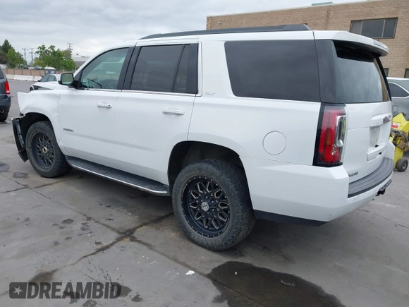 2019 GMC Yukon SLT with VIN 1GKS2BKC3KR160060, listed as a IAAI auction lot 42042122 with 124,733 mi miles. Bid and sale history available at carsss.com. Image 3.