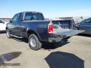 2000 Ford F-150 XL with VIN 1FTRX18L2YKA10388, listed as a IAAI auction lot 41526430 with 144,480 mi miles. Bid and sale history available at carsss.com. Image 3.