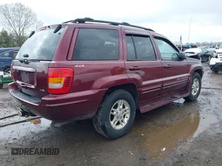 1999 Jeep Grand Cherokee Limited with VIN 1J4GW68N5XC642670, listed as a IAAI auction lot 41990199 with 154,492 mi miles. Bid and sale history available at carsss.com. Image 4.