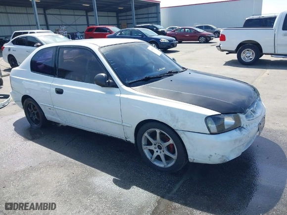2002 Hyundai Accent GL with VIN KMHCG35C32U213819, listed as a IAAI auction lot 41834267 with 167,798 mi miles. Bid and sale history available at carsss.com. Image 1.