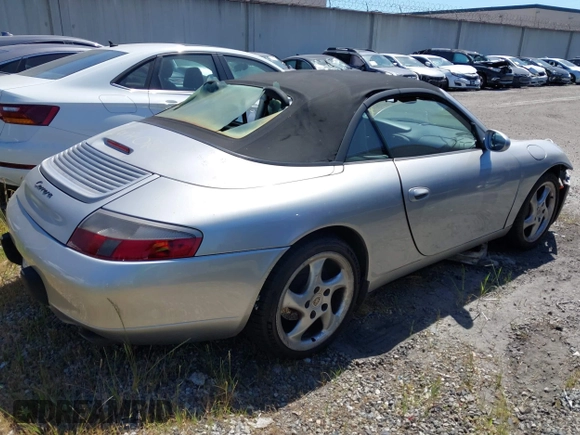 1999 Porsche 911 with VIN WP0CA2999XS652816, listed as a IAAI auction lot 41975822 with 291,258 mi miles and . Bid and sale history available at DreamBid. Image 4.