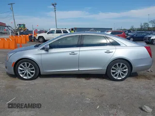 2016 Cadillac XTS Luxury Collection z VIN 2G61M5S33G9107107, wystawiony jako IAAI lot #42072608 z przebiegiem 130 542 mil mil oraz . Historia ofert i sprzedaży dostępna na DreamBid. Obrazek 14.