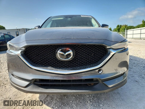 2020 Mazda CX-5 Grand Touring z VIN JM3KFADM2L0803589, wystawiony jako Copart lot #61916825 z przebiegiem 63 663 mil mil oraz Szkoda całkowita • Salvage title. Historia ofert i sprzedaży dostępna na DreamBid. Obrazek 5.