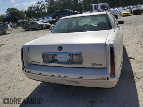 1999 Cadillac DeVille z VIN 1G6KD54YXXU794473, wystawiony jako Copart lot #79774804 z przebiegiem 44 601 mil mil oraz Czysty tytuł • Clean title. Historia ofert i sprzedaży dostępna na DreamBid. Obrazek 6.