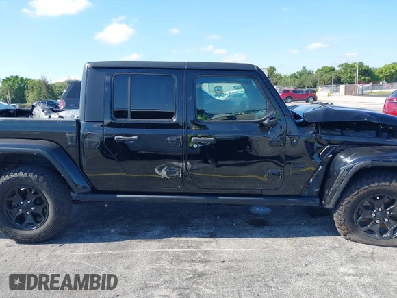 2021 Jeep Gladiator Willys with VIN 1C6HJTAGXML613431, listed as a IAAI auction lot 42180502 with 64,572 mi miles and . Bid and sale history available at DreamBid. Image 13.