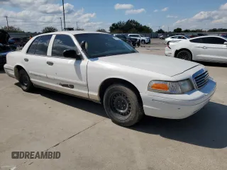 1999 Ford Crown Victoria Police with VIN 2FAFP71WXXX198735, listed as a Copart auction lot 70526134 with 116,889 mi miles and Clean Title. Bid and sale history available at carsss.com. Image 4.