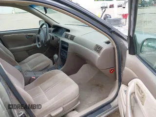 1997 Toyota Camry LE z VIN 4T1BG22KXVU034196, wystawiony jako IAAI lot #42504214 z przebiegiem 155 915 mil mil oraz . Historia ofert i sprzedaży dostępna na DreamBid. Obrazek 5.