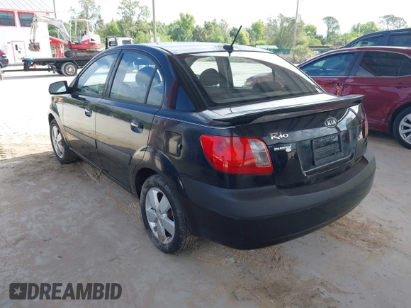 2009 Kia Rio LX with VIN KNADE223496561265, listed as a IAAI auction lot 42143889 with 235,634 mi miles and . Bid and sale history available at DreamBid. Image 3.