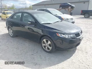 2010 Kia Forte EX with VIN KNAFU4A21A5284262, listed as a IAAI auction lot 42032999 with 145,558 mi miles. Bid and sale history available at carsss.com. Image 1.