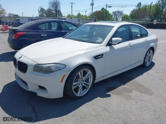 2013 BMW M5 with VIN WBSFV9C58DC773268, listed as a IAAI auction lot 41890830 with 128,399 mi miles. Bid and sale history available at carsss.com. Image 2.