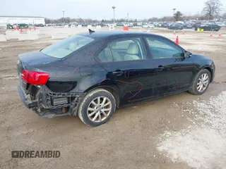 2012 Volkswagen Jetta Sedan SE w/Convenience with VIN 3VWDX7AJ5CM398348, listed as a IAAI auction lot 41708085 with 147,477 mi miles. Bid and sale history available at carsss.com. Image 4.